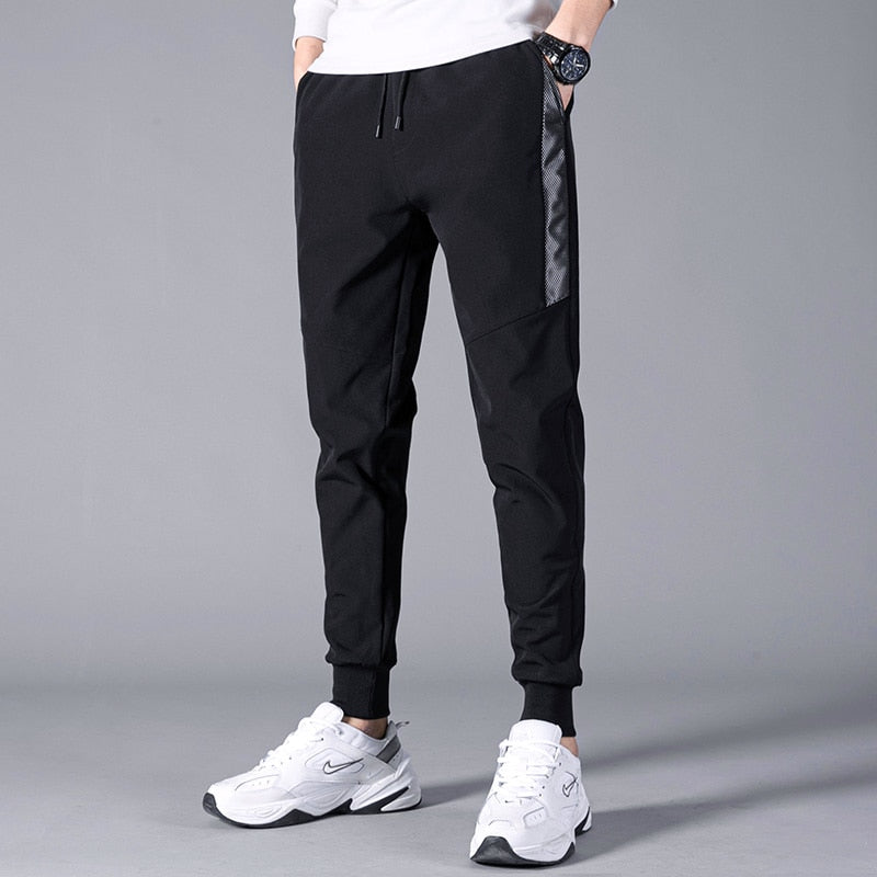 Korean Summer Men'S Thin Splicing 9-Point Pants Ice Silk Ventilation Trend Straight Tube Loose Elastic Legged Casual Trousers