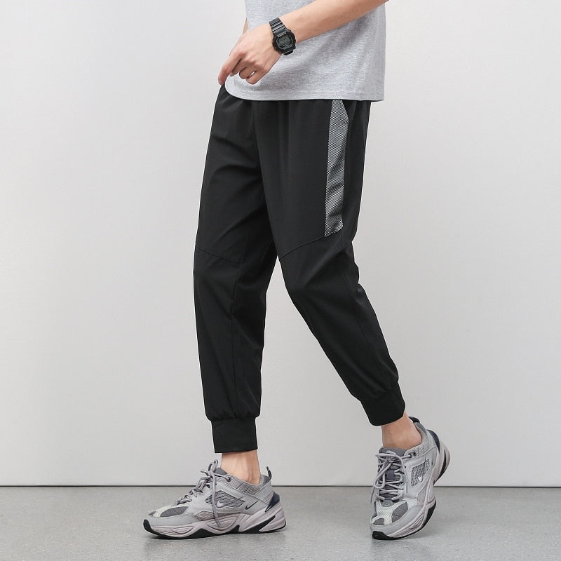 Korean Summer Men'S Thin Splicing 9-Point Pants Ice Silk Ventilation Trend Straight Tube Loose Elastic Legged Casual Trousers