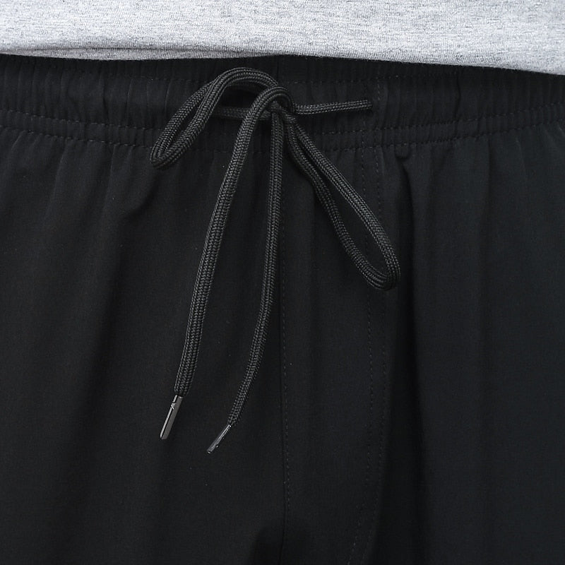Korean Summer Men'S Thin Splicing 9-Point Pants Ice Silk Ventilation Trend Straight Tube Loose Elastic Legged Casual Trousers