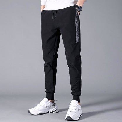 Korean Summer Men'S Thin Splicing 9-Point Pants Ice Silk Ventilation Trend Straight Tube Loose Elastic Legged Casual Trousers