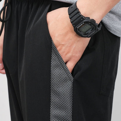 Korean Summer Men'S Thin Splicing 9-Point Pants Ice Silk Ventilation Trend Straight Tube Loose Elastic Legged Casual Trousers